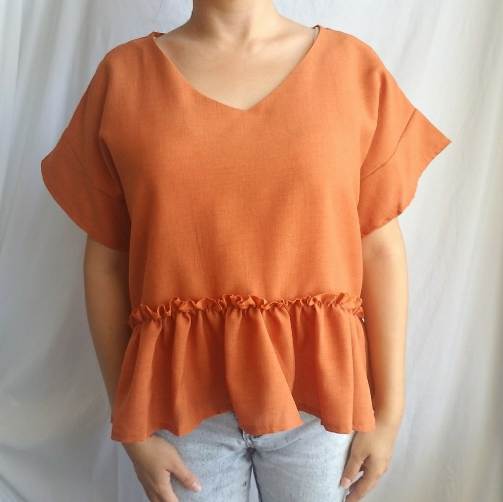 Ruffle crop top in burnt orange